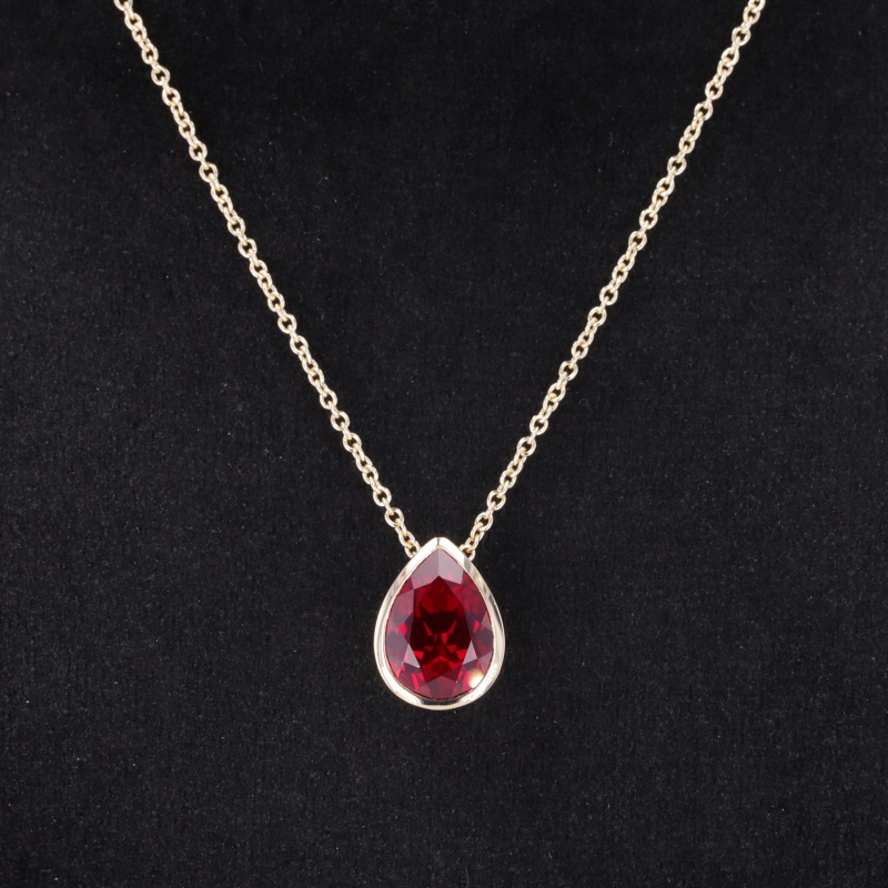 8×11mm Pear Cut Lab Grown Ruby Bezel Set 10K Yellow Gold Diamond Pendant Necklace