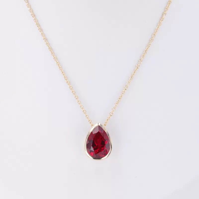 8×11mm Pear Cut Lab Grown Ruby Bezel Set 10K Yellow Gold Diamond Pendant Necklace